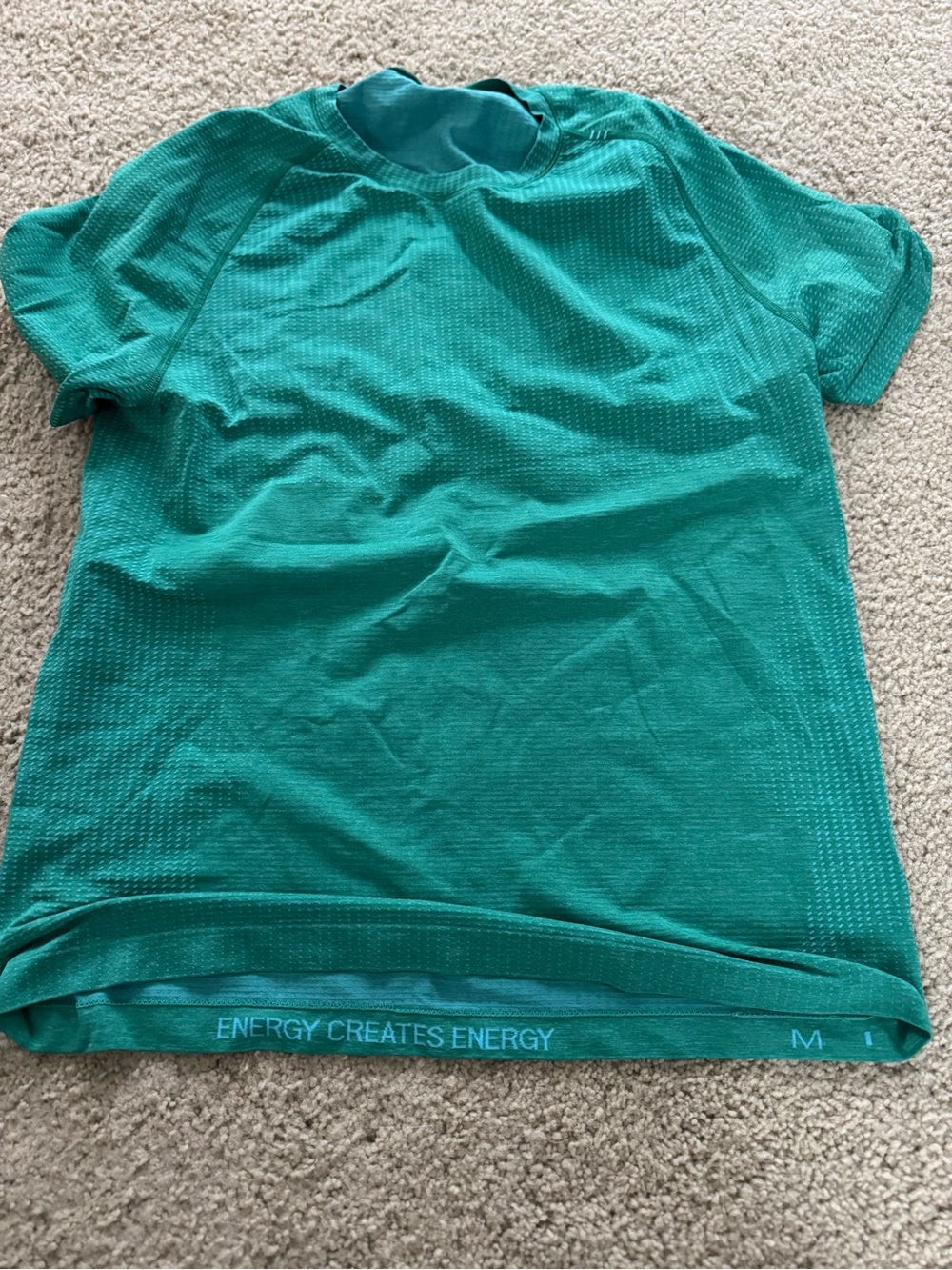 Lululemon Teal Performance Tee with 'ENERGY CREATES ENERGY' Waistband